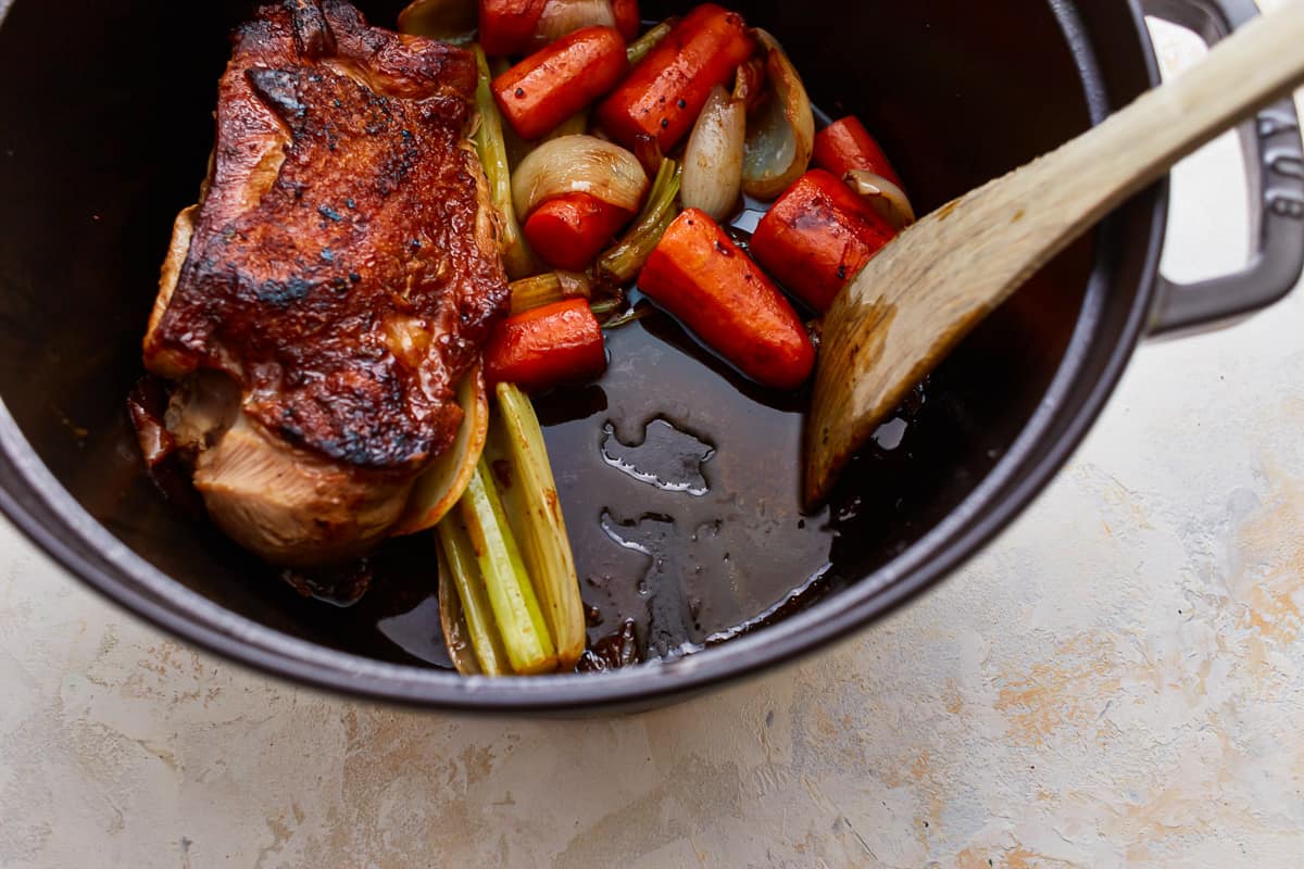 A pot filled with vegetables and turkey.