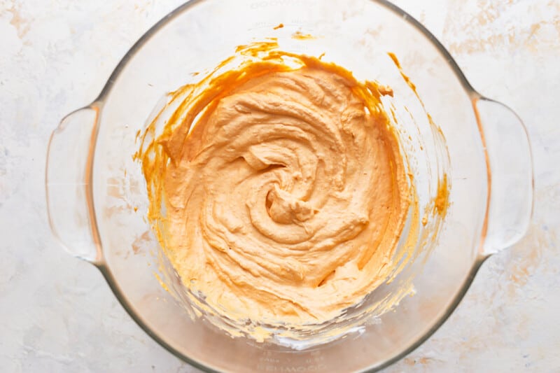 Pumpkin mixture in a mixing bowl.