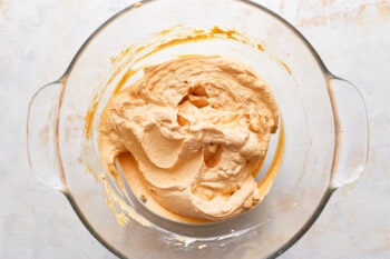 No bake pumpkin cheesecake batter in a glass bowl.