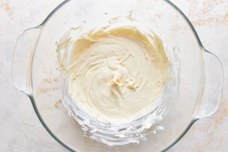 Whipped cream in a glass bowl.