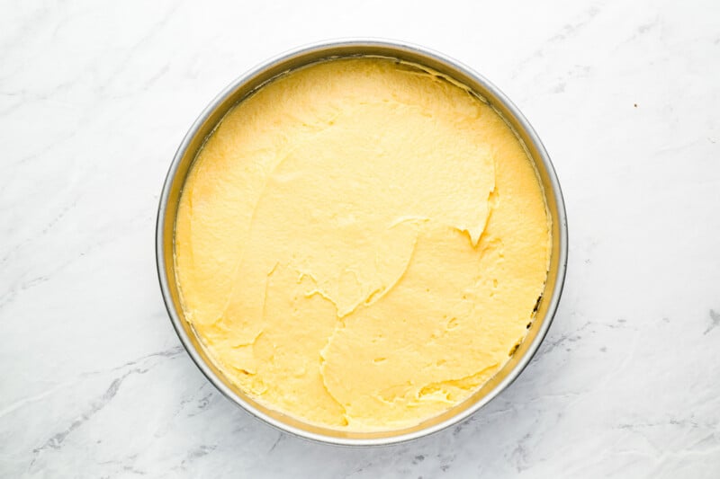 A pan with a yellow batter in it.