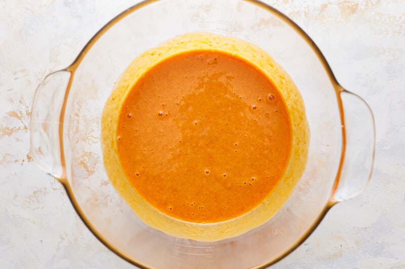 A glass bowl filled with a pumpkin mixture.