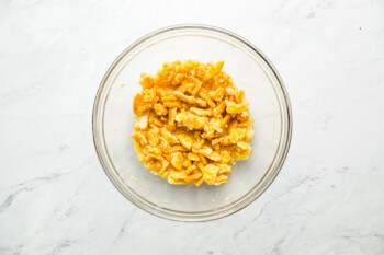 crushed ritz crackers and butter in a glass bowl.