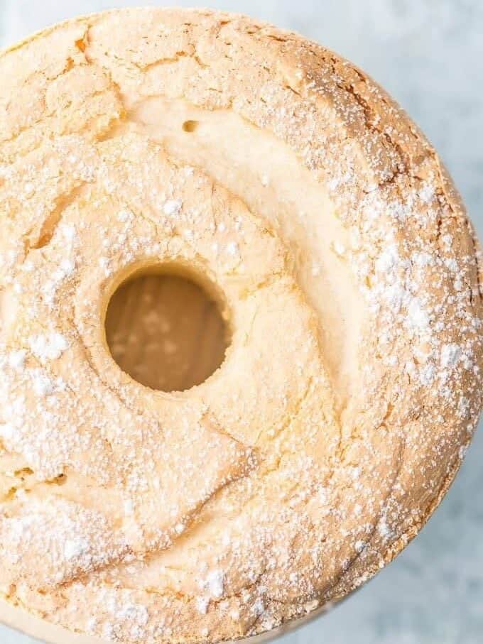 top view of angel food cake with powdered sugar dusting