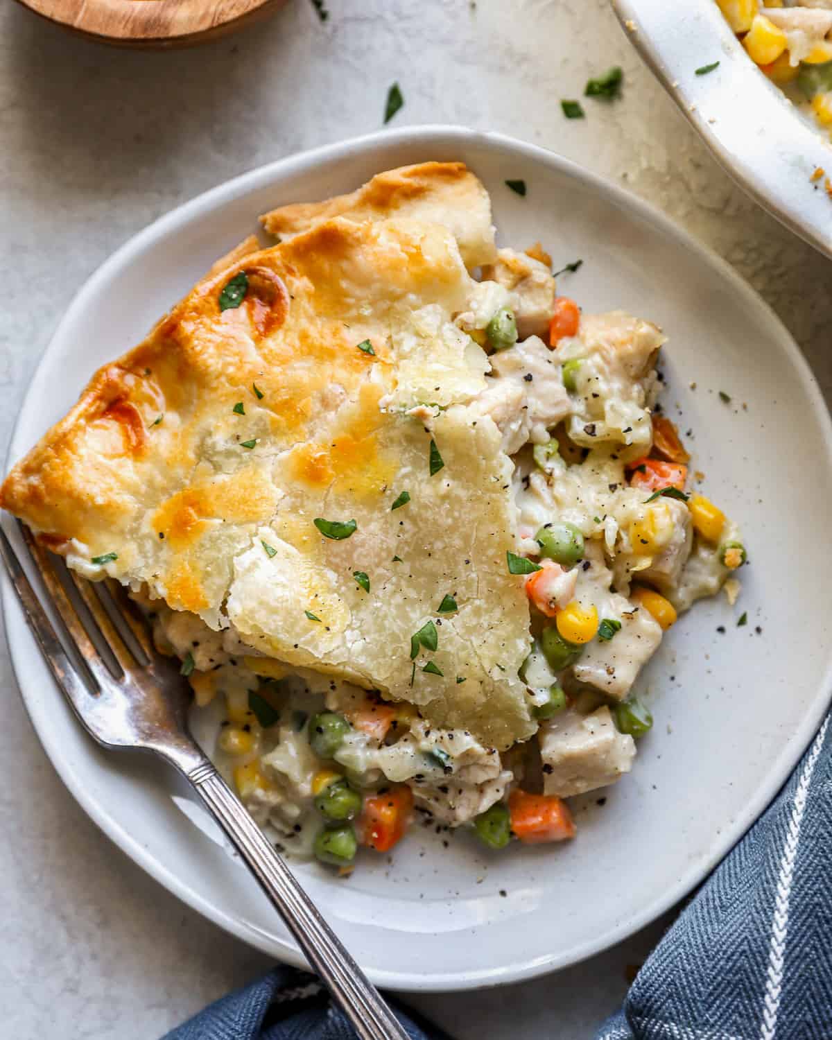 Turkey pot pie on a plate with a fork.