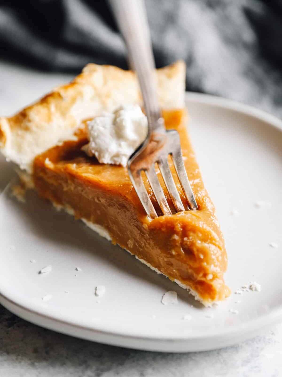 fork slicing into a piece of pie