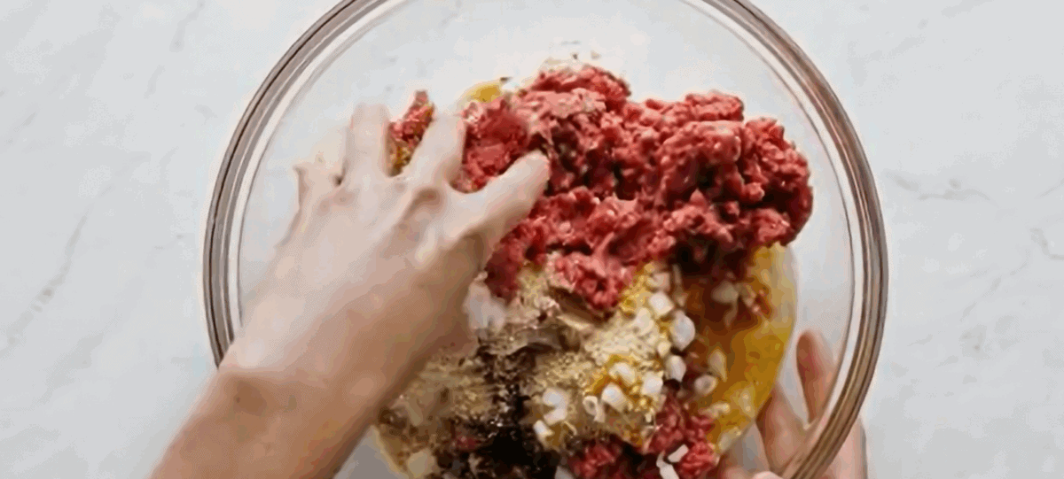 All the ingredients to make cocktail meatballs in a bowl. 