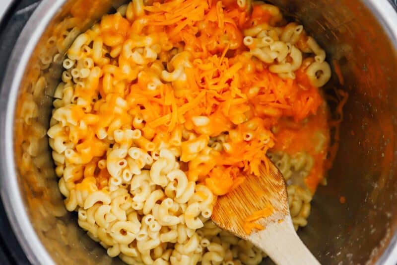 mixing shredded cheese into instant pot macaroni
