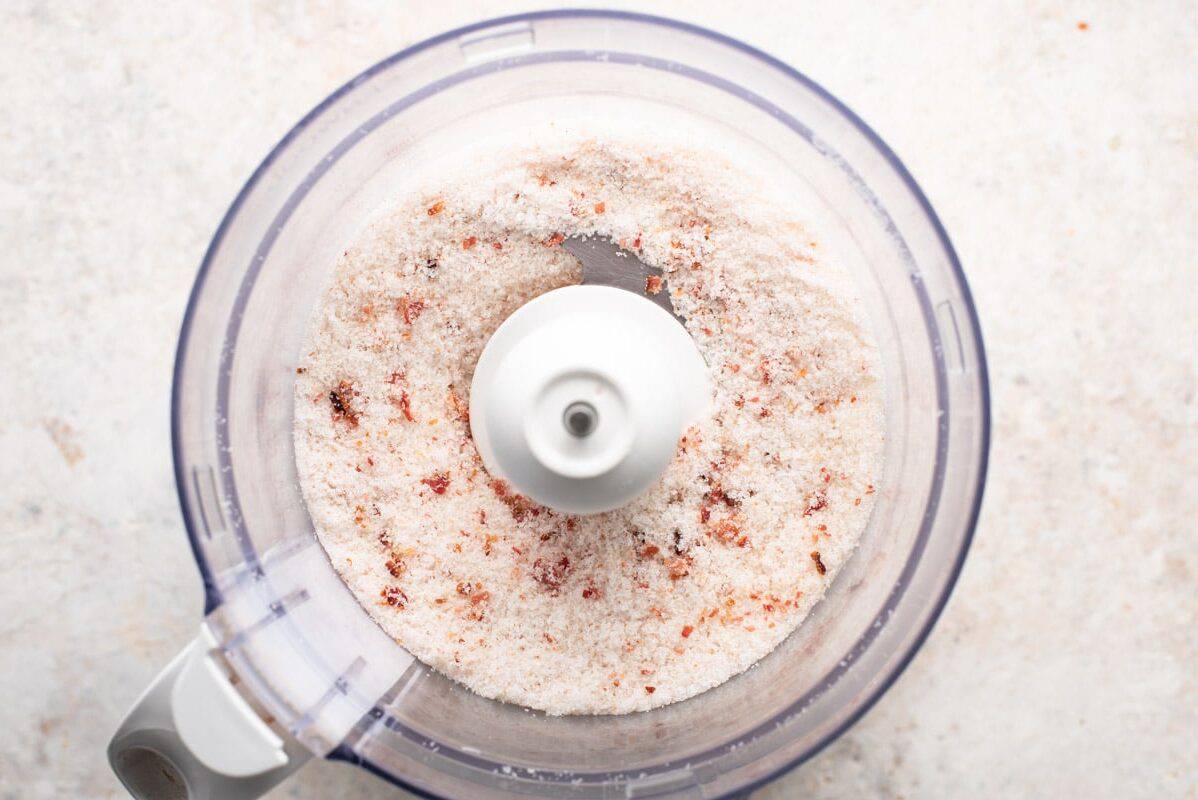 a food processor filled with popcorn salt.