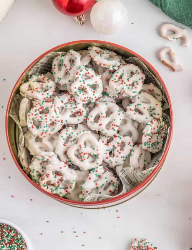 christmas pretzels in a bowl with sprinkles.