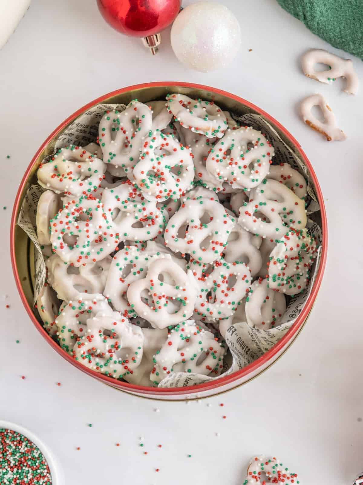 christmas pretzels in a bowl with sprinkles.