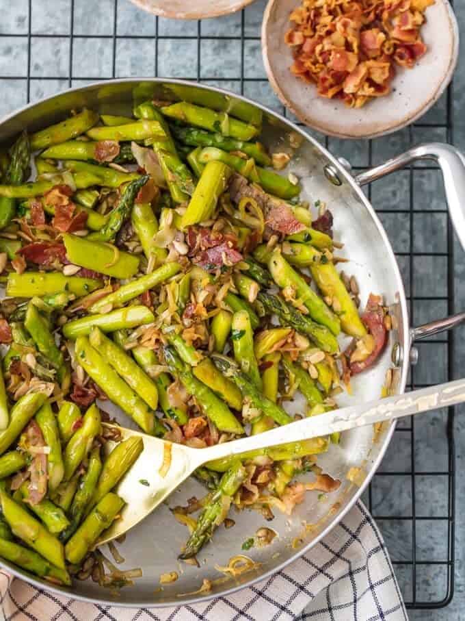 A mixture of asparagus, leeks, Pancetta, garlic, in a skillet