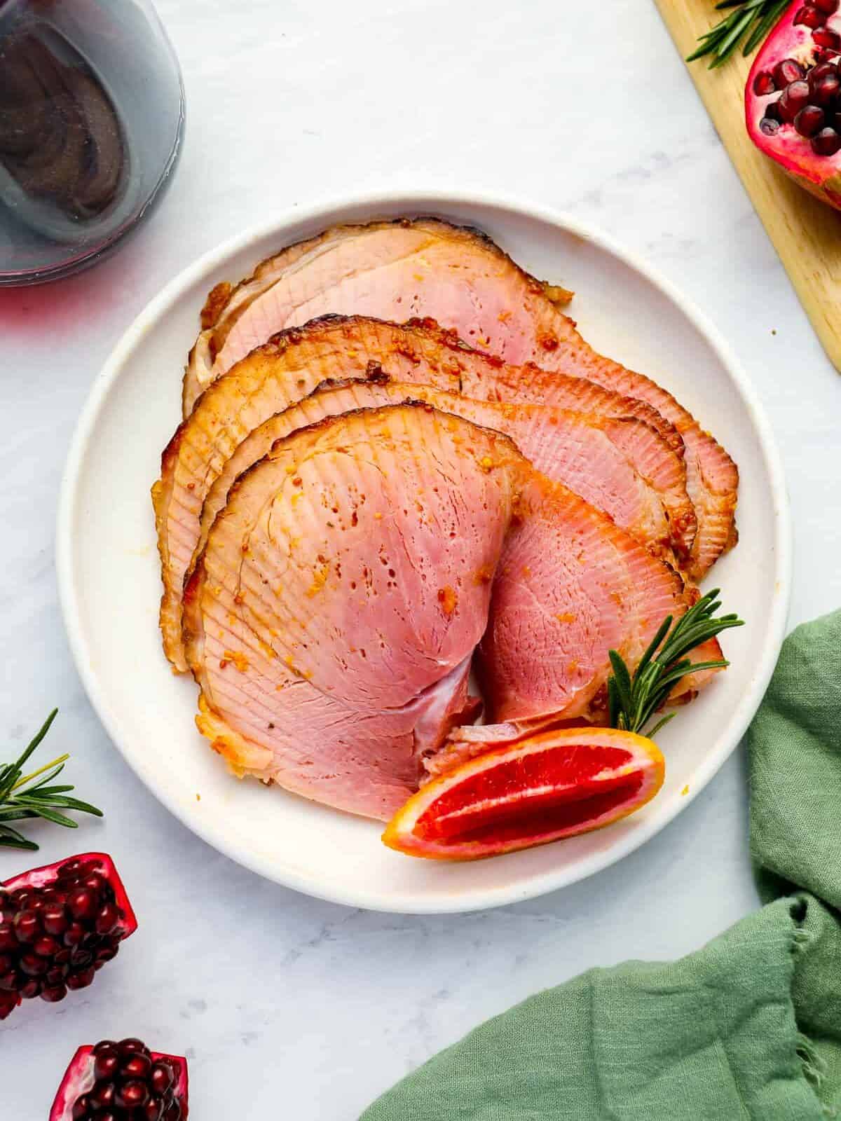slices of glazed Christmas ham on a plate.