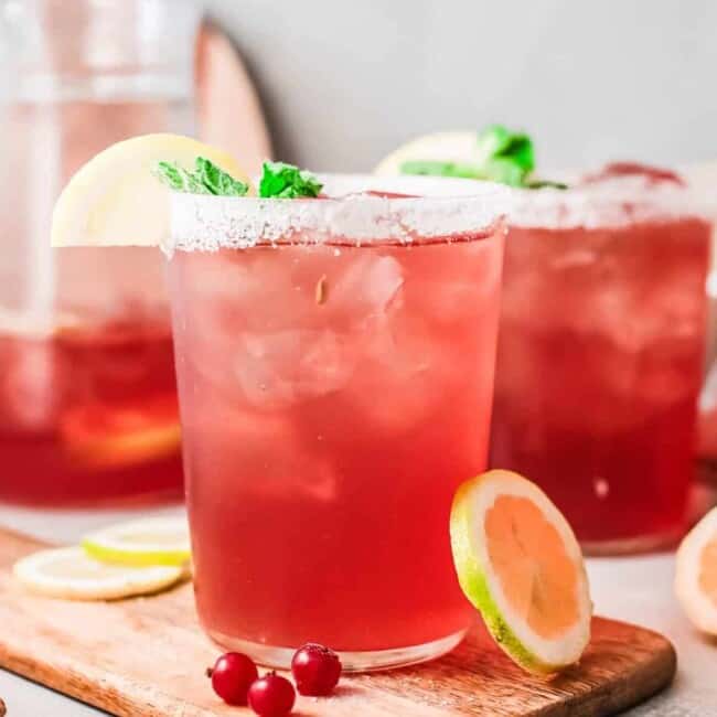 cranberry margaritas in glasses with salt rims