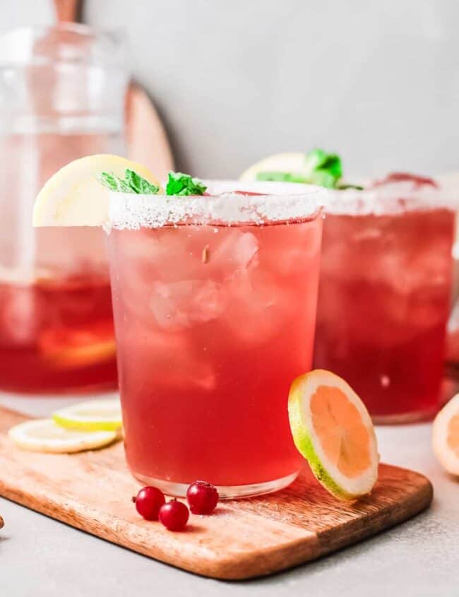 cranberry margaritas in glasses with salt rims