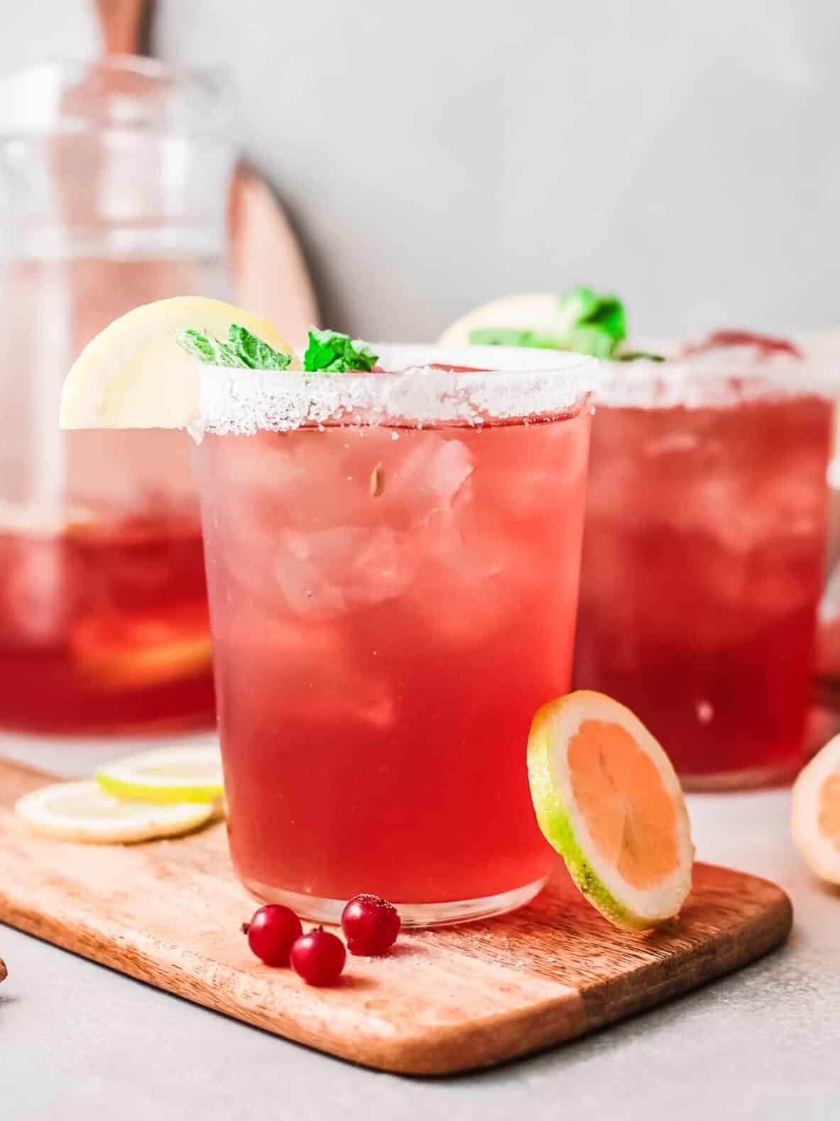 cranberry margaritas in glasses with salt rims