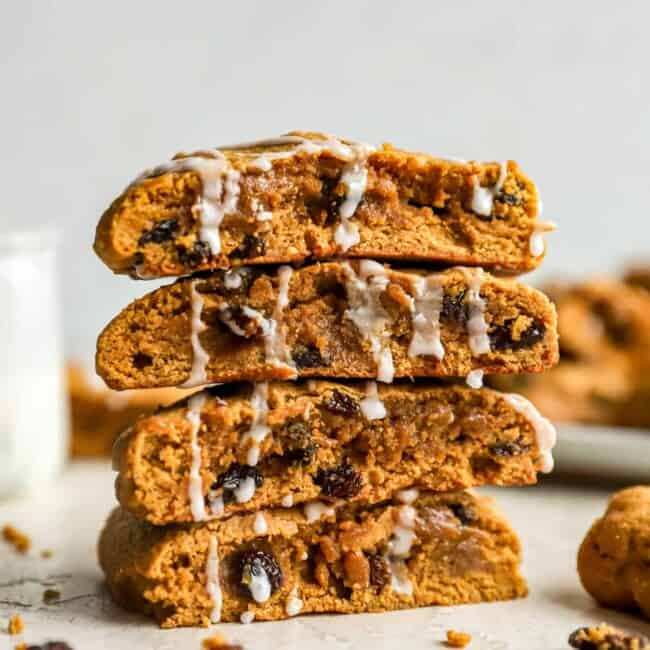 Pumpkin raisin cookies stacked on top of each other.