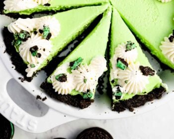a slice of green oreo pie on a white plate.