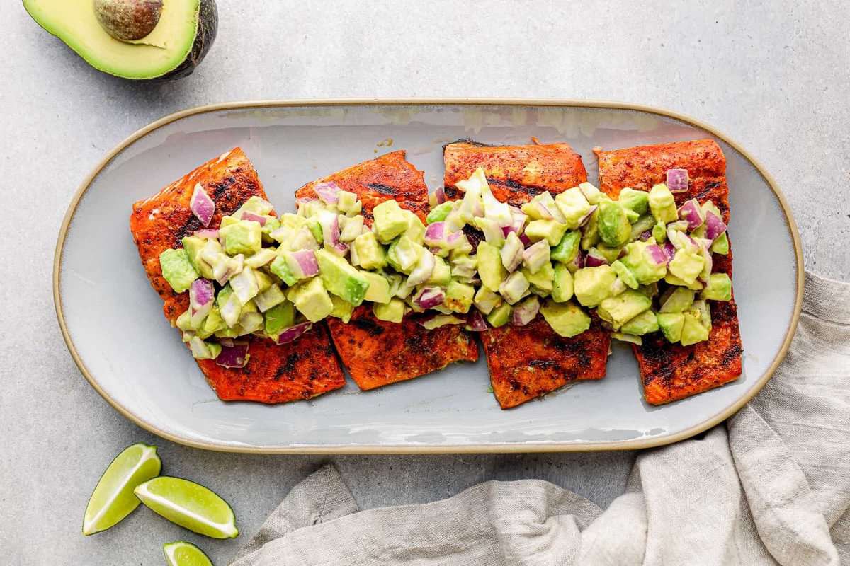platter of healthy grilled salmon with avocado salsa
