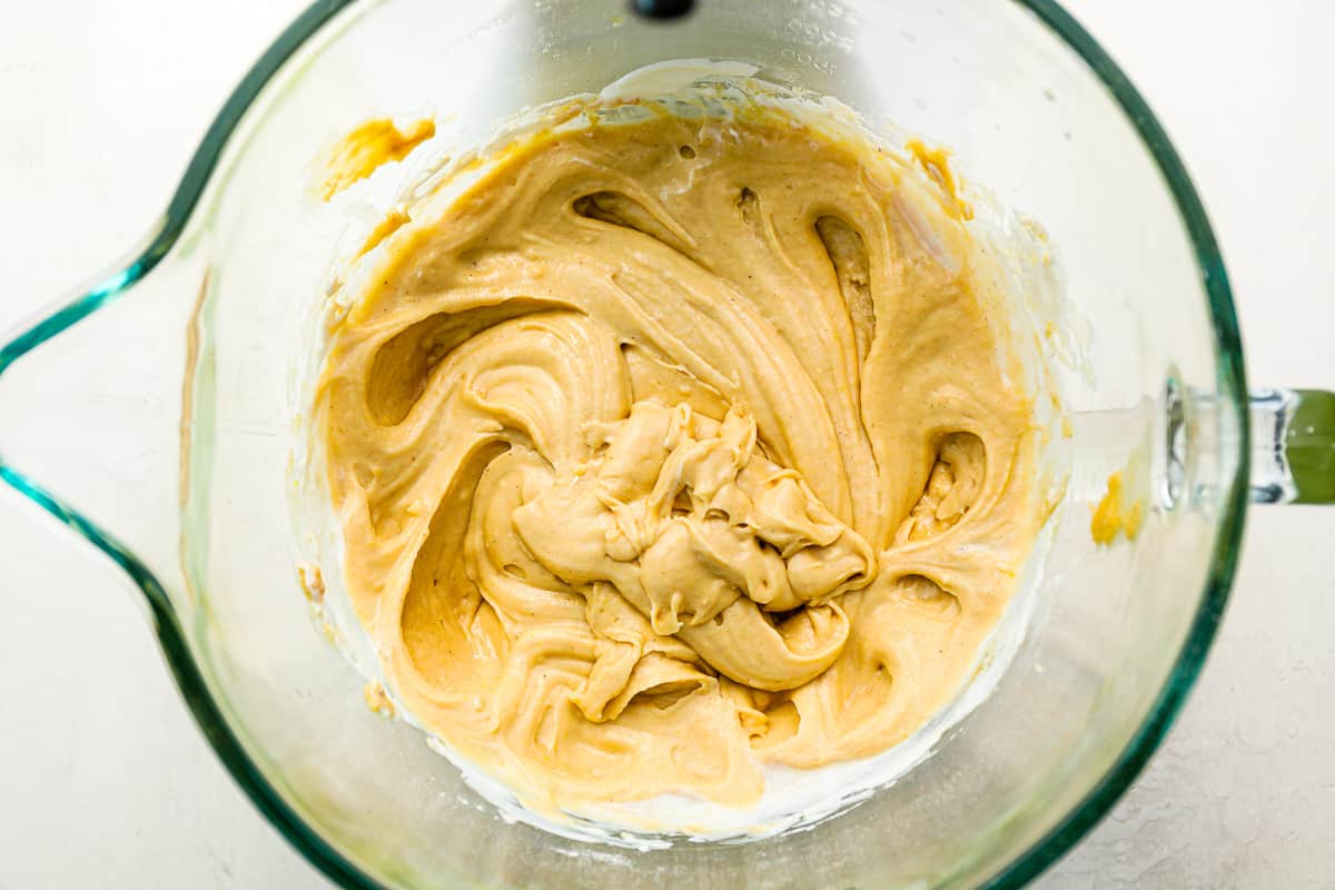 A glass bowl filled with a cake batter.