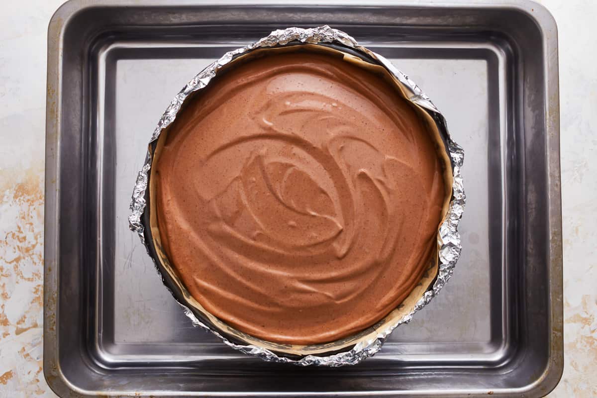 Chocolate cheesecake in a waterbath.