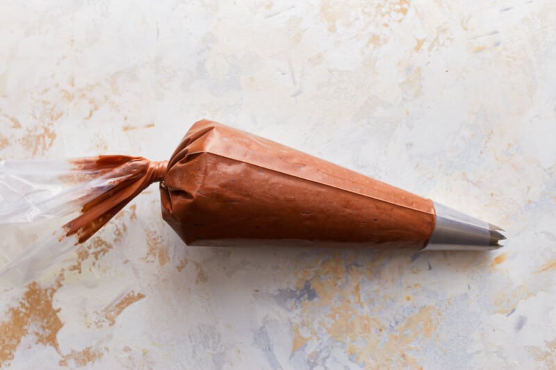 Chocolate frosting in a piping bag.