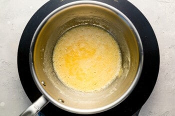 A pot with a yellow liquid in it.