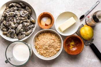 The ingredients for a recipe for oysters on the half shell.
