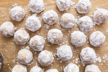 snowballl cookies rolled in powdered sugar.