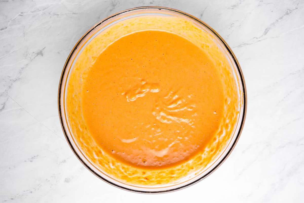 overhead view of sweet potato pie filling in a glass bowl.