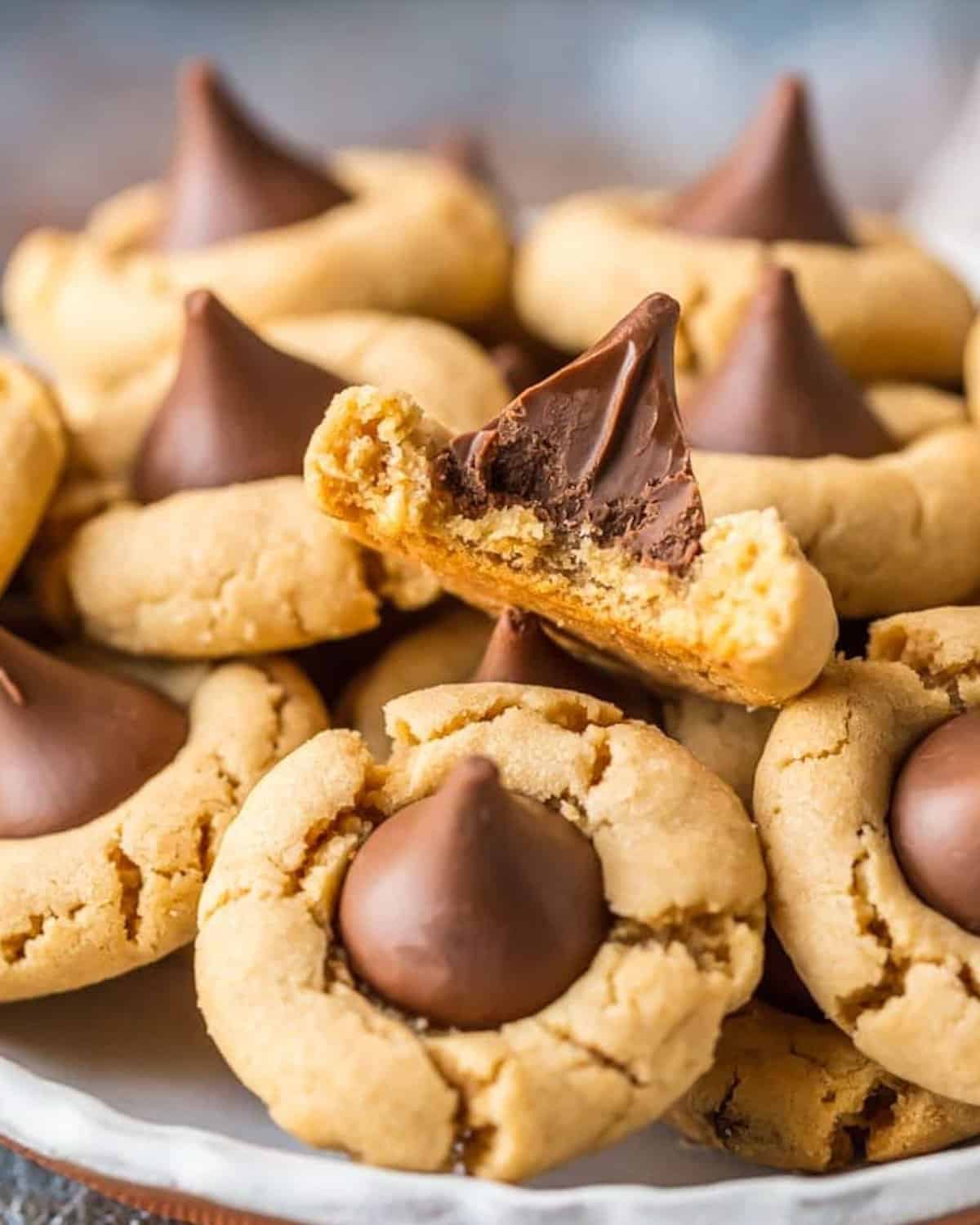 Hershey Kiss cookies with a bite taken out of them.