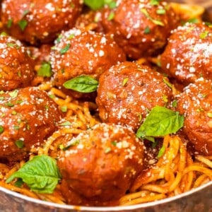 meatballs over pasta in pan