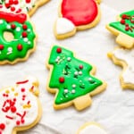 A bunch of decorated christmas cookies on a piece of paper.