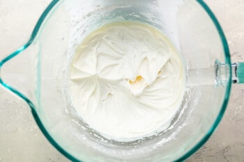 Whipped cream in a glass bowl.