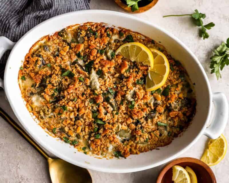 A casserole dish with a lemon wedge on it.