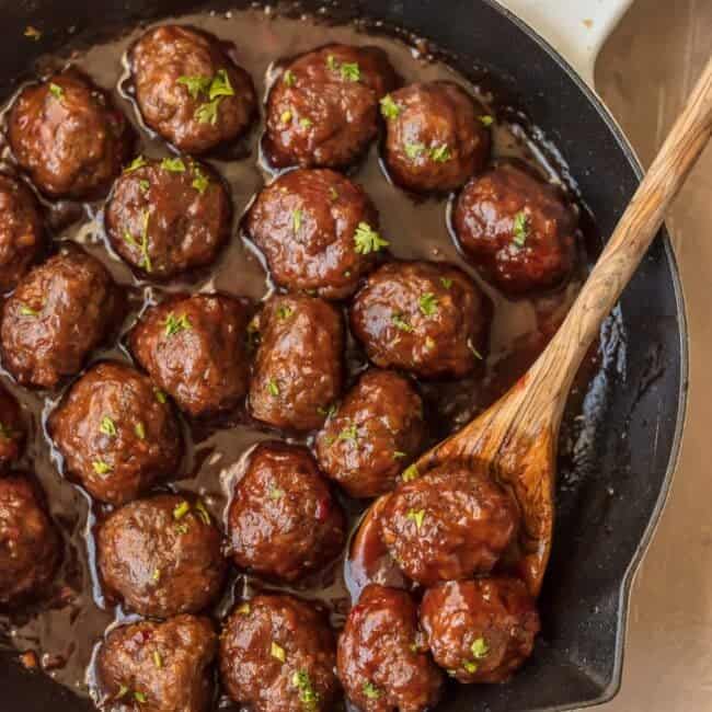 SWEET & SPICY CRANBERRY COCKTAIL MEATBALLS are the perfect holiday appetizer! Cooked in a cranberry pepper jelly sauce; SO delicious! The best Thanksgiving, Christmas, or New Years Eve appetizer!