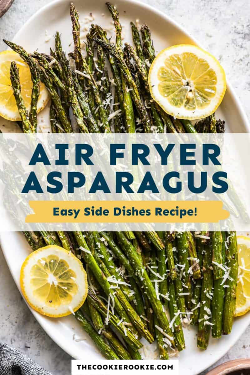 Air fryer asparagus on a plate with lemon slices.