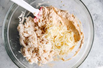 combining crab dip ingredients in a mixing bowl