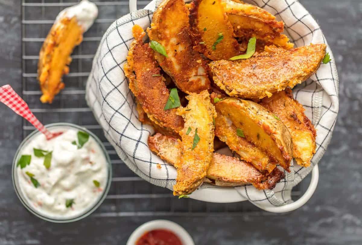 These CRISPY PARMESAN POTATO WEDGES are so absolutely delicious and EASY! You'll never go back to regular fries after you try these thick potato wedges coated in a crispy cheese shell. Just too good!