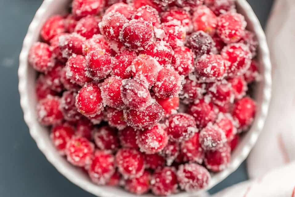 top shot of easy sugared cranberries in white bowl