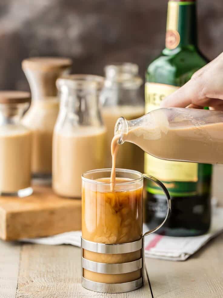 pouring homemade bailey's into a a glass