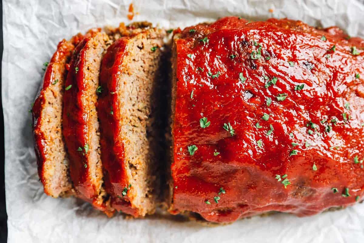 Overhead view of sliced meatloaf made in a Crockpot or slow cooker.