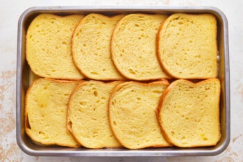 Slices of French toast bread in a pan.