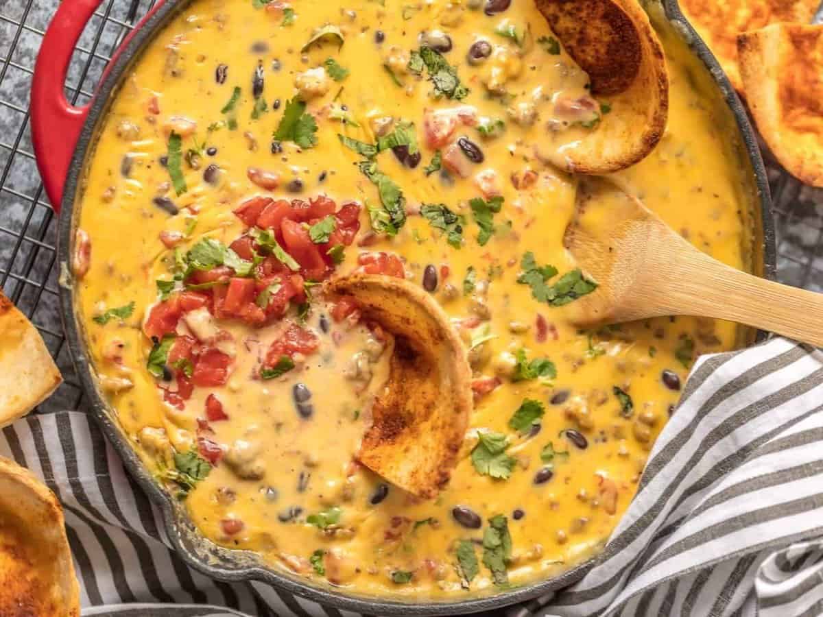 Velveeta Queso recipe with rotel, sausage, beans, and more