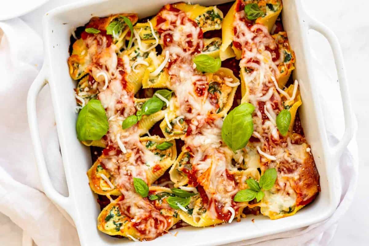 casserole dish with stuffed shells with spinach.