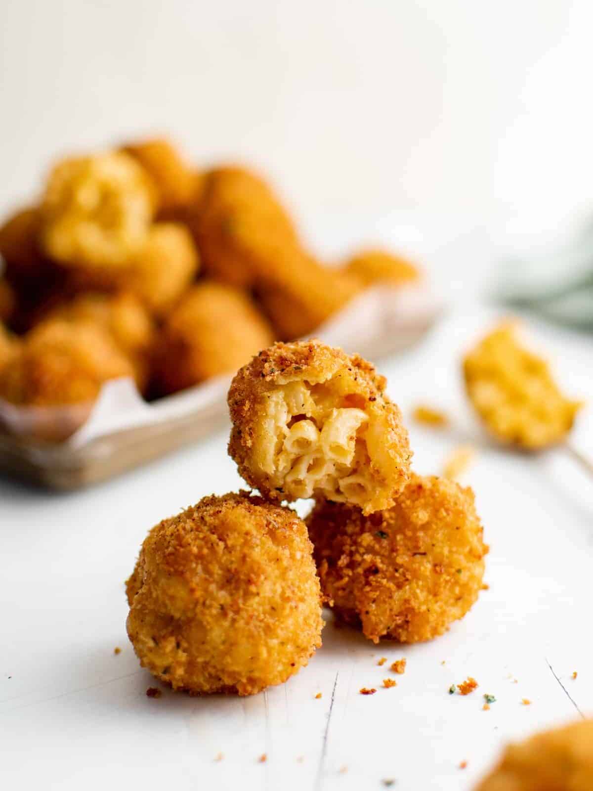 Macaroni and cheese balls stacked on top of each other