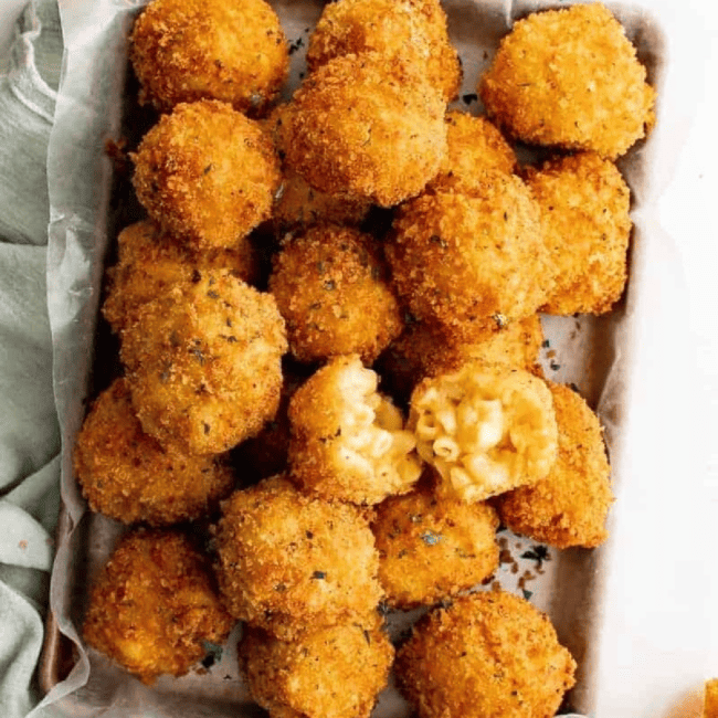 Mac and cheese balls baked in a dish.