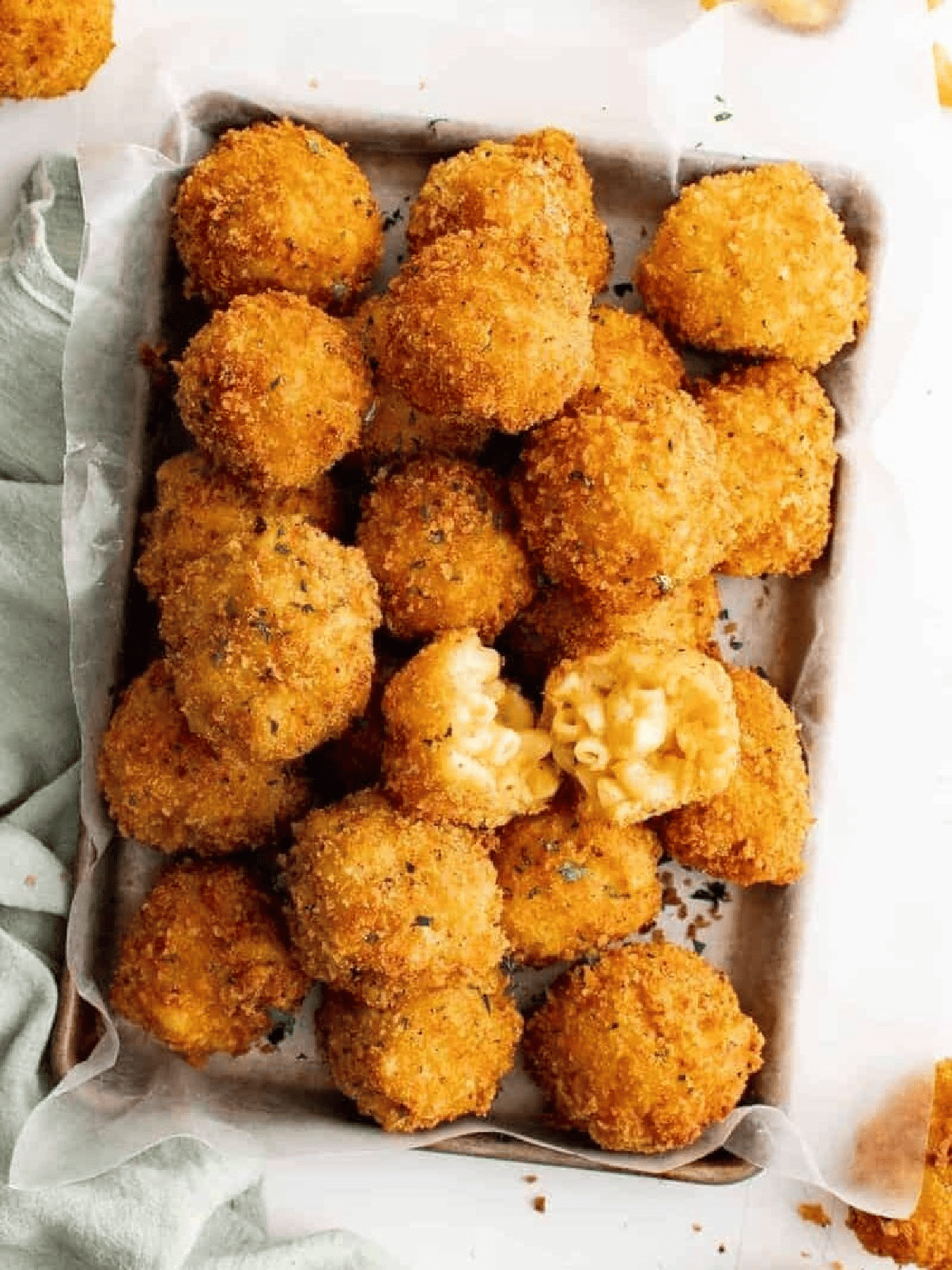 Mac and cheese balls baked in a dish.
