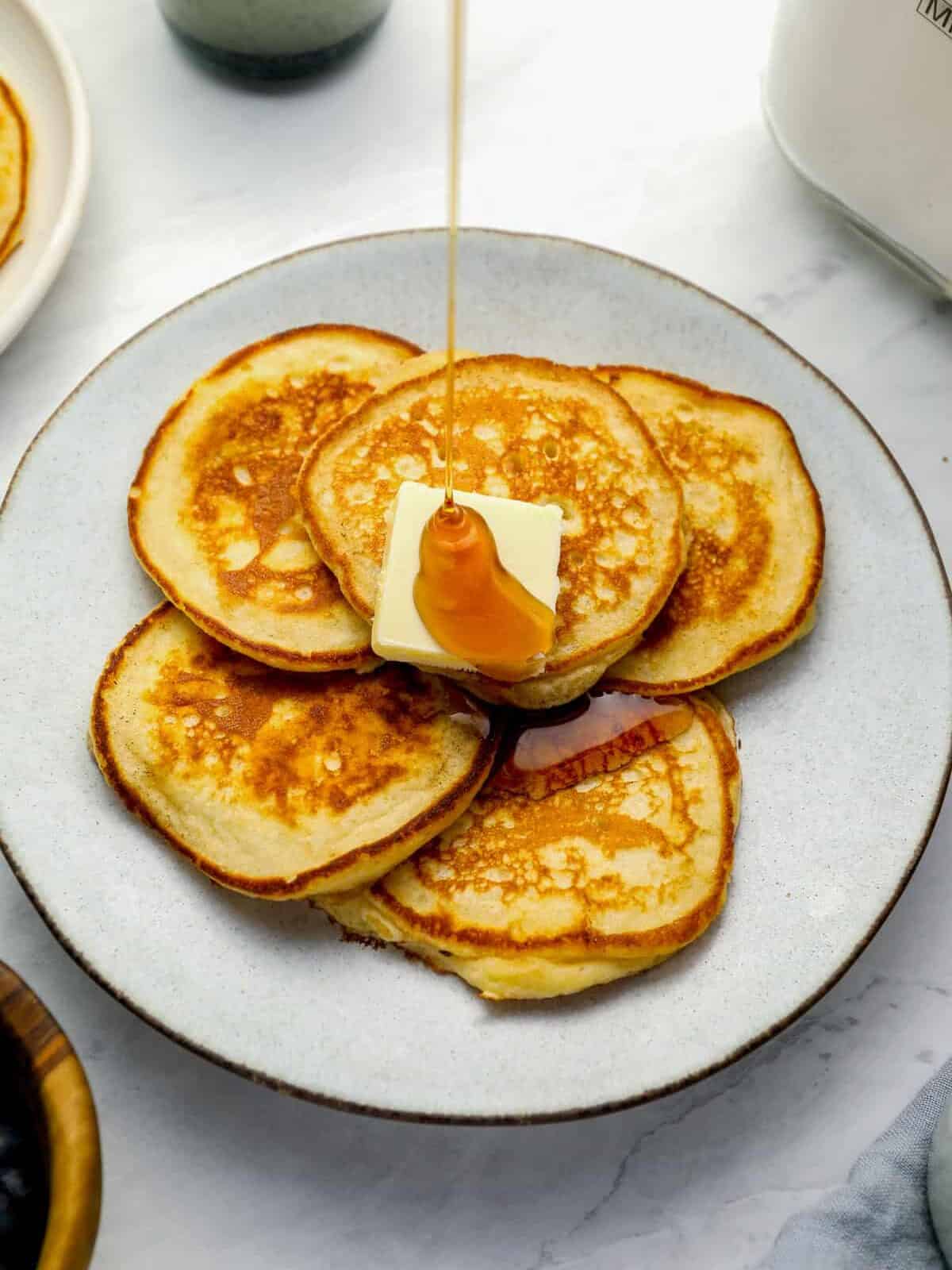 three-quarters view of a plate full of pancakes made from homemade pancake mix