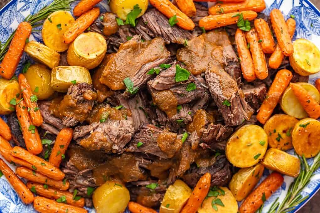 close up view of pot roast with carrots and potatoes